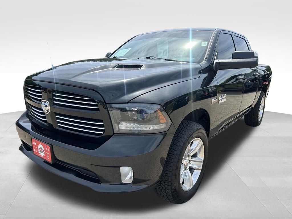 2015 RAM 1500 Sport in Brilliant Black Crystal Pearlcoat — front three-quarter view